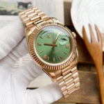 Rolex Day-Date 40mm President 18kt YG White Dial 228238 Bevelled Deconstructed (Green face with gold strap)